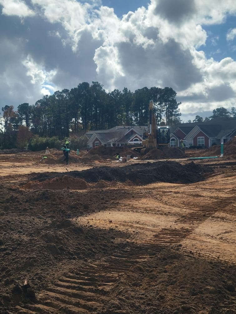 JSW Construction crew and excavator on a residential sitework project in the Lowcountry